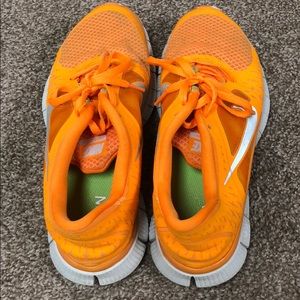 Orange Nike shoes